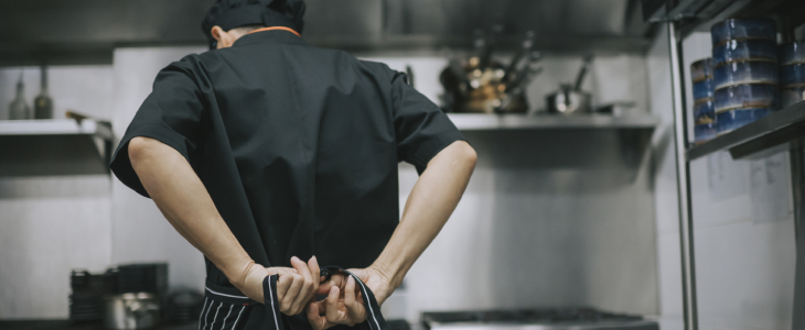 chef tying on his apron